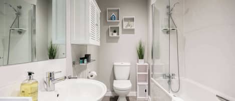 Shower, hair dryer, towels, shampoo