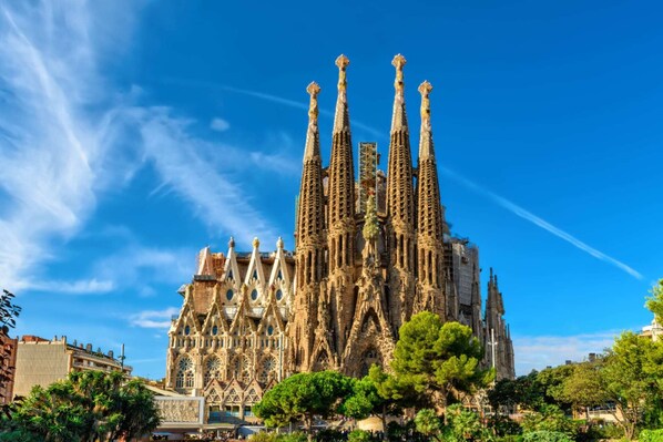 A historic building with intricate Gothic architecture, featuring multiple spires and ornate details.