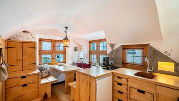 Fridge, stovetop, dishwasher, coffee/tea maker