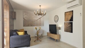 Classic House, 2 Bedrooms, Sea View | Living area | 55-inch TV with digital channels - Holiday Home Jan (Novalja)