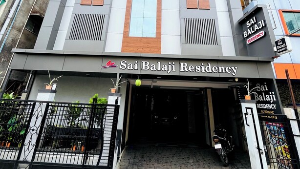 A modern building with a sign reading "Sai Balaji Residency." - sai balaji residency (Rahata)