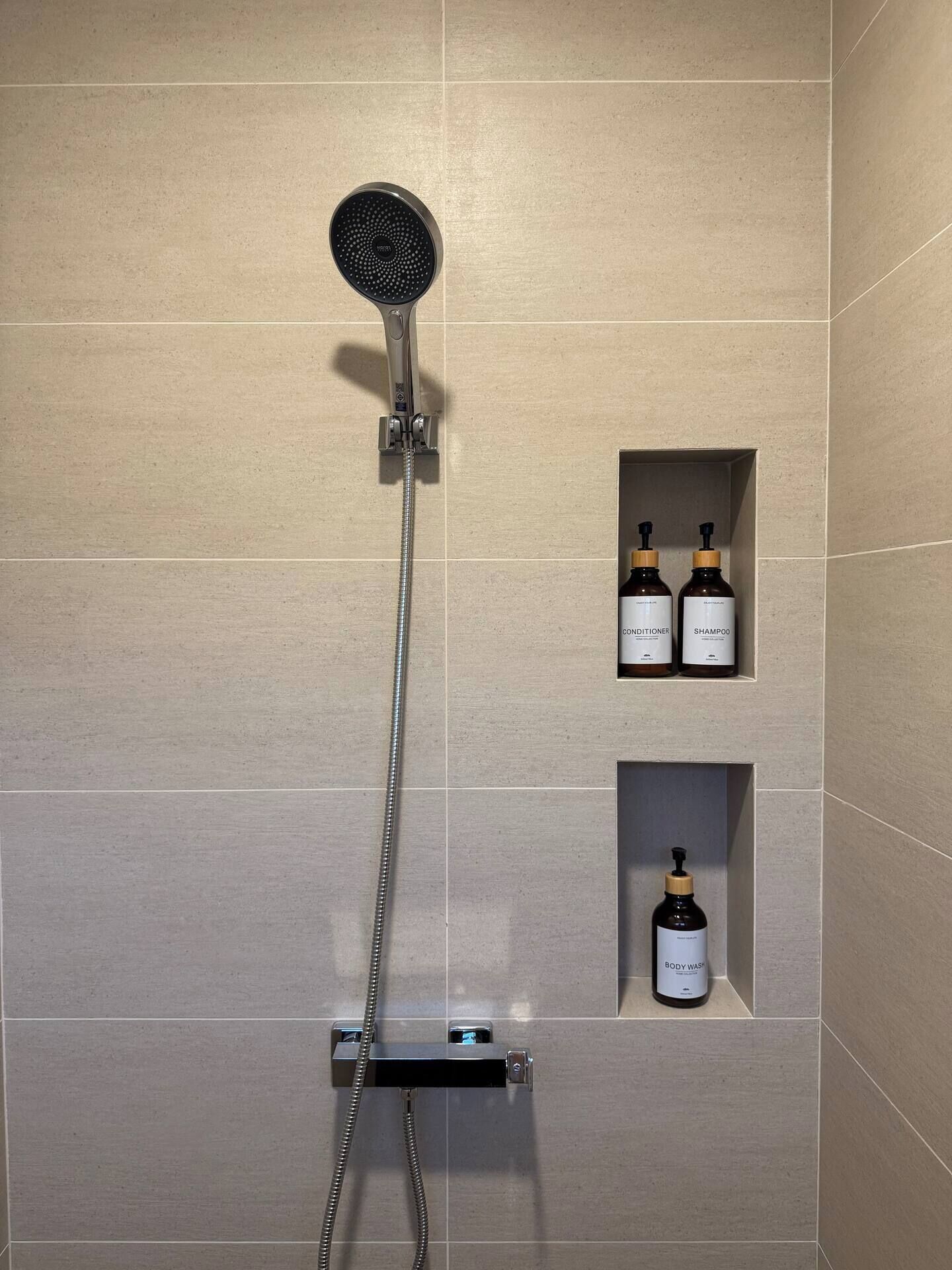 Shower, hair dryer, towels, soap