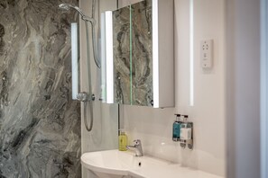 Shower, hair dryer, towels, soap