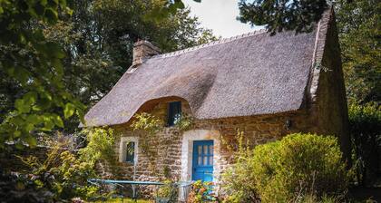 Cozy typical Breton chaumiere with thatched roof