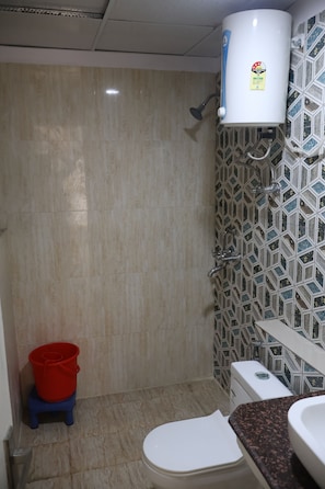 Shower, towels, soap, toilet paper