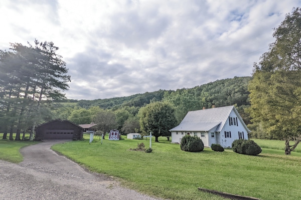 Picturesque countryside home surrounded by lush greenery and serene landscapes.
