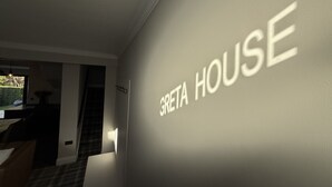 A room with a wall-mounted sign reading "GRETA HOUSE". - Greta House - Luxury refurbished accommodation (Central Keswick)