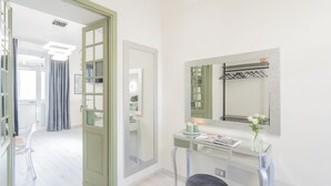 A modern bathroom with a vanity, mirror, and towel rack. - Cernobbio Dream Suites by Rent all Como (Cernobbio)