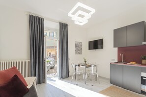 Apartment (Grey Suite) | Living area | 32-inch TV with cable channels - Cernobbio Dream Suites by Rent all Como (Cernobbio)