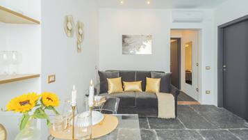 Apartment (Gold Suite) | Living area | 32-inch flat-screen TV with cable channels