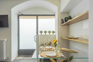 Apartment (Gold Suite) | Living area | 32-inch flat-screen TV with cable channels