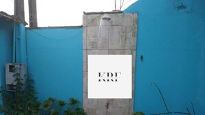 A blue wall with a white sign that reads "KDT".