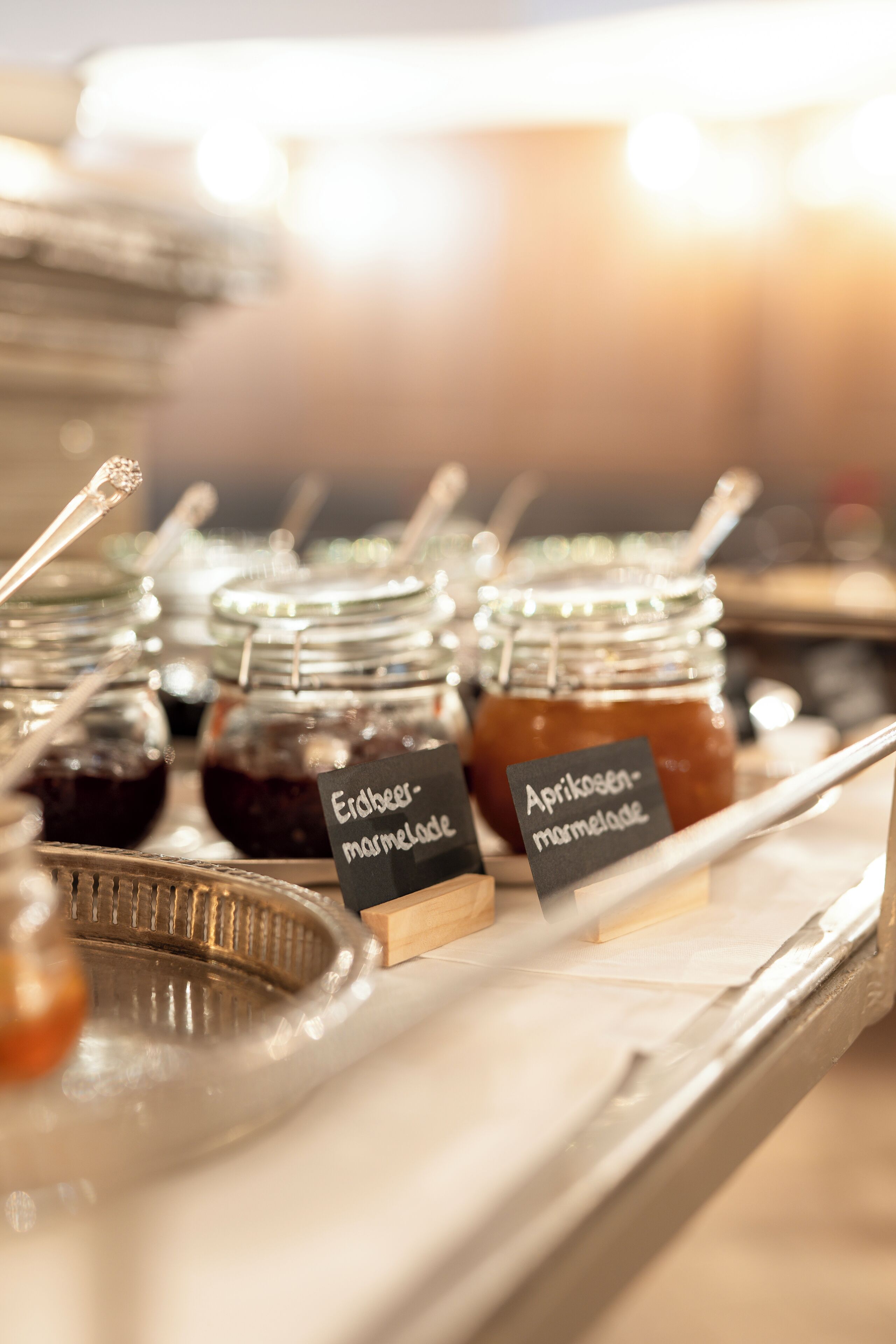 A display of jars labeled with different types of marmalade.