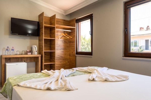 Desk, laptop workspace, free WiFi, bed sheets