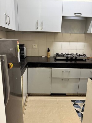 Fridge, microwave, toaster, cookware/dishes/utensils