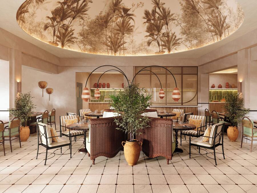 A spacious dining area with round tables, wicker chairs, and potted plants.
