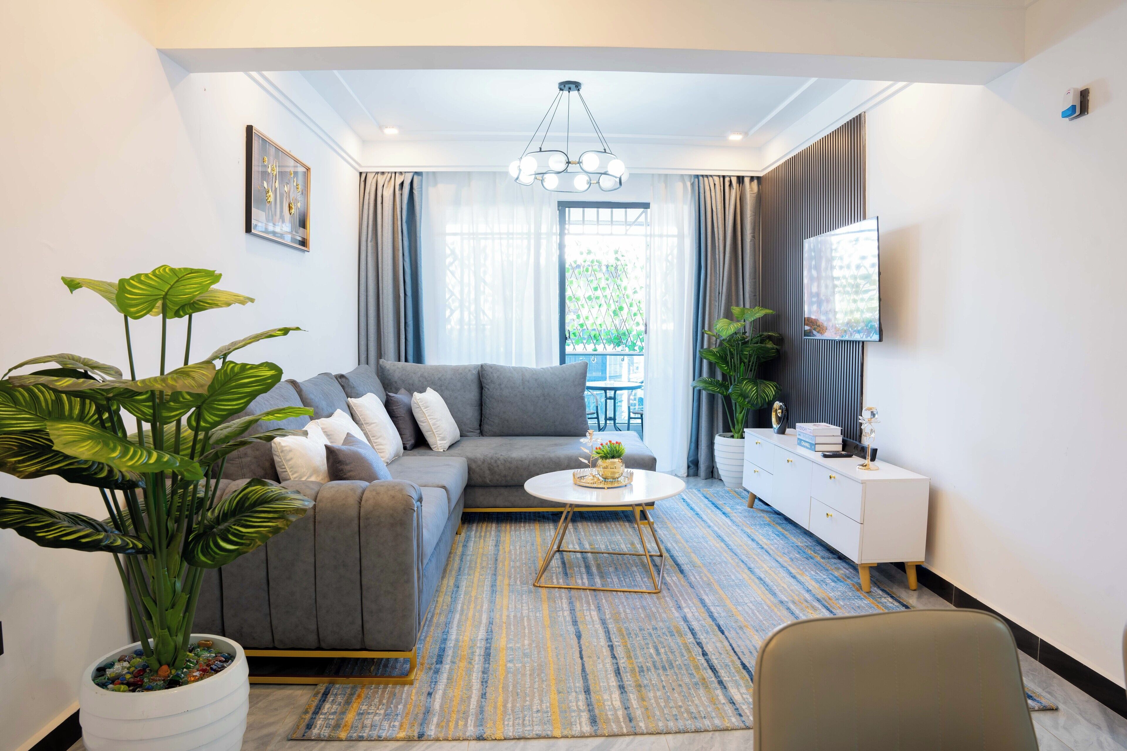 Departamento superior, 1 habitación, baño privado, vista a la ciudad | Área de sala de estar