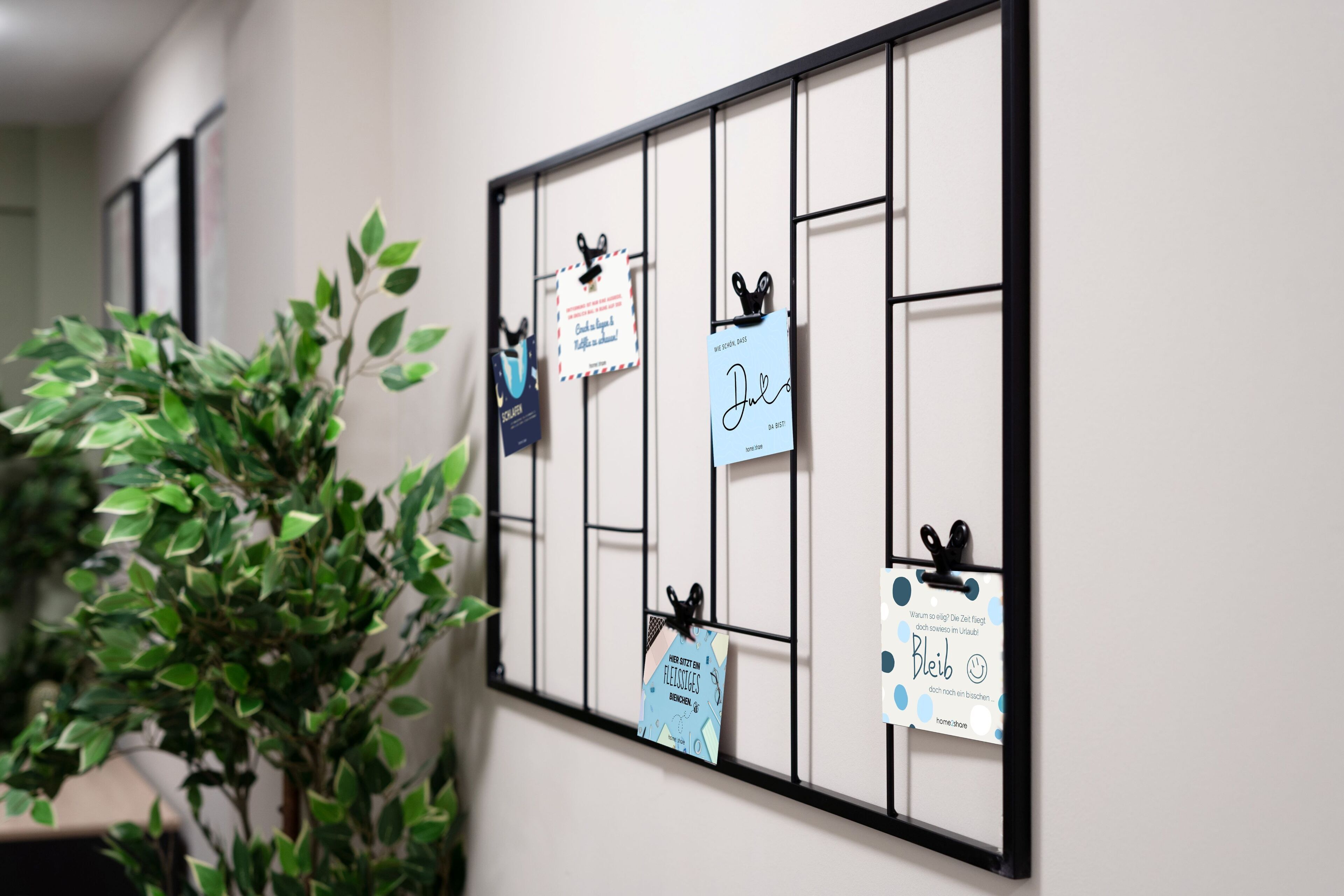 A wall with a bulletin board displaying various notes and tags.