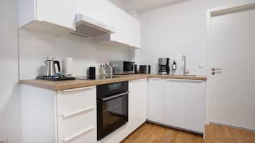 Family Apartment | Private kitchen | Full-size fridge, microwave, oven, stovetop