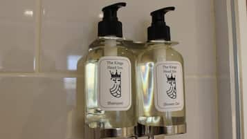 Two bottles of The Kings Head Inn shampoo and shower gel.