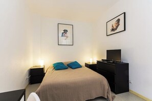 1 bedroom, desk, iron/ironing board, travel crib