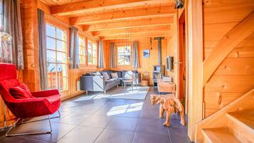 Basic Chalet | Living area | TV, fireplace, books