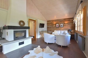 Basic Chalet | Living area | TV, fireplace, books