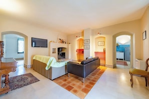 Family Apartment, Multiple Bedrooms, 2 Bathrooms (Nella Apartment With Pool) | Living area | 21-inch flat-screen TV with cable channels, TV, fireplace