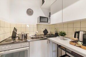 Family Apartment, Multiple Bedrooms (Residenza Tasso Sul Lago) | Private kitchen | Fridge, microwave, oven, stovetop