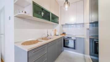 Family Apartment, 1 Bedroom (Modern Oasis With Terrace) | Private kitchen | Fridge, microwave, oven, stovetop