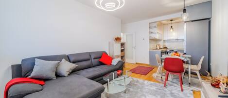 Family Apartment, Multiple Bedrooms (Modern Oasis With Terrace) | Living room | Flat-screen TV