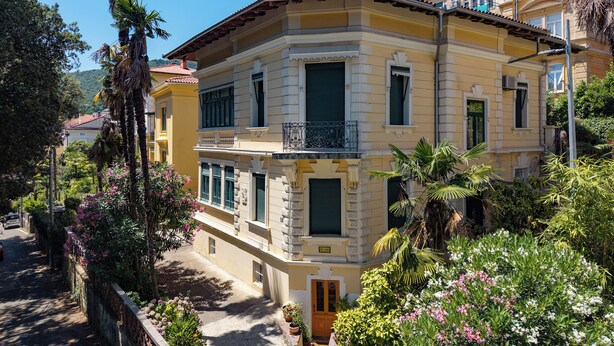 A multi-story building with balconies, a central entrance, and surrounding greenery. - Sea and City Retreat Opatija (Opatija)
