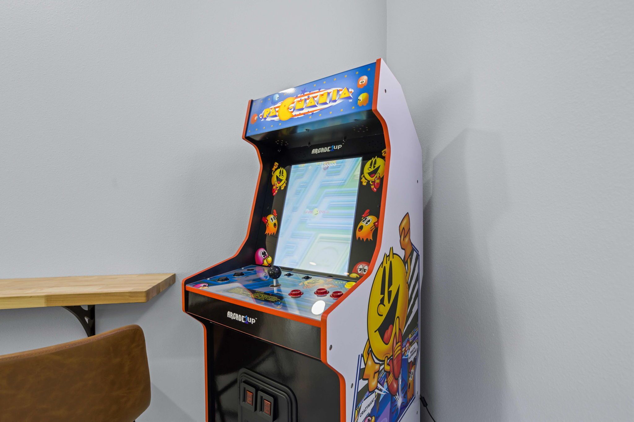 A retro arcade machine with a colorful display and joystick.