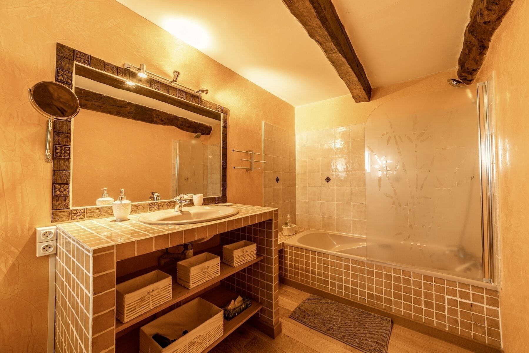 A bathroom with two sinks, a large bathtub, and a shower.