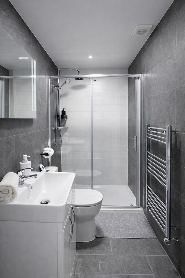 Shower, hair dryer, towels, soap