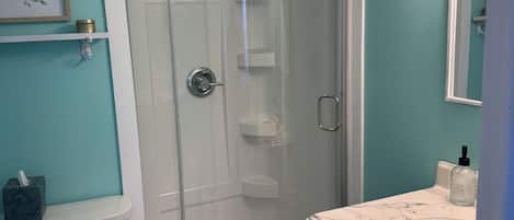 Shower, hair dryer, towels, toilet paper