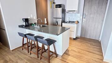 Fridge, microwave, coffee/tea maker, toaster