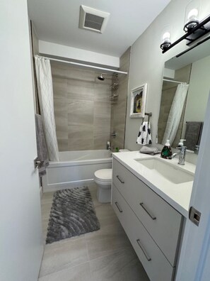 Shower, hair dryer, towels, soap