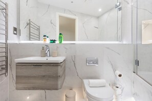 Shower, hair dryer, towels, soap
