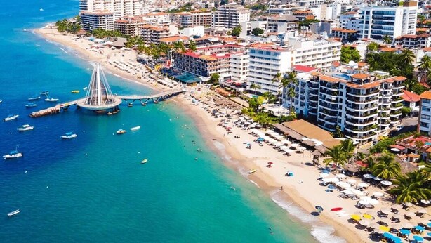 An aerial view of a coastal city with a prominent bridge, beachfront hotels, and a marina with boats. - Gorgeous Villa Marina Vallarta, pool, Free Shuttle (Puerto Vallarta)