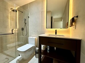 A modern bathroom with a glass-enclosed shower, a toilet, a sink with a mirror, and a towel rack. - Gorgeous Villa Marina Vallarta, pool, Free Shuttle (Puerto Vallarta)