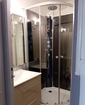 Shower, hair dryer, towels, soap