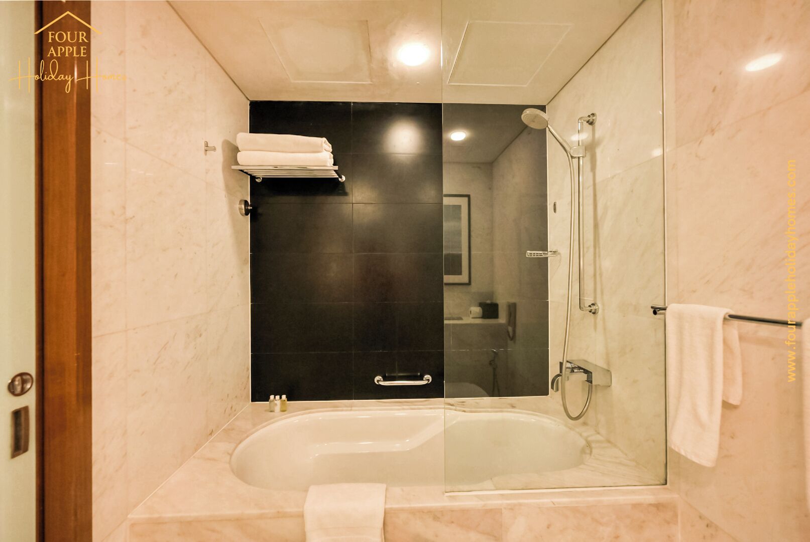 A modern bathroom with a glass-enclosed shower, a bathtub, and a towel rack.