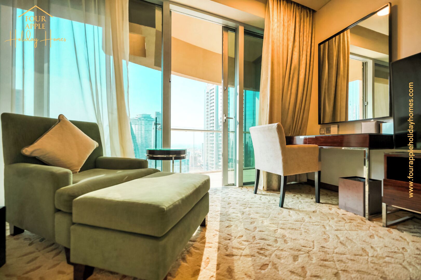 A hotel room with a green armchair, a white chair, a desk, and a large mirror.