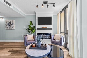 Smart TV, fireplace, books, video library