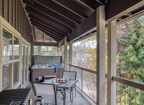 Relax in this serene outdoor space, complete with a grill, hot tub, and comfortable seating.