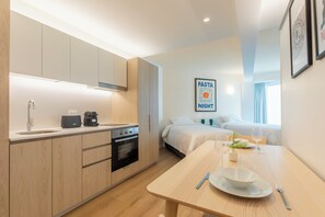 Family Studio Suite, Non Smoking | Private kitchen | Fridge, microwave, oven, stovetop