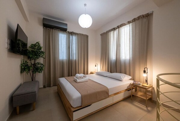 1 bedroom, desk, iron/ironing board, travel crib