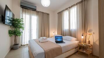 1 bedroom, desk, iron/ironing board, travel crib