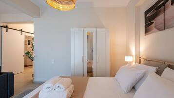 1 bedroom, desk, iron/ironing board, travel crib